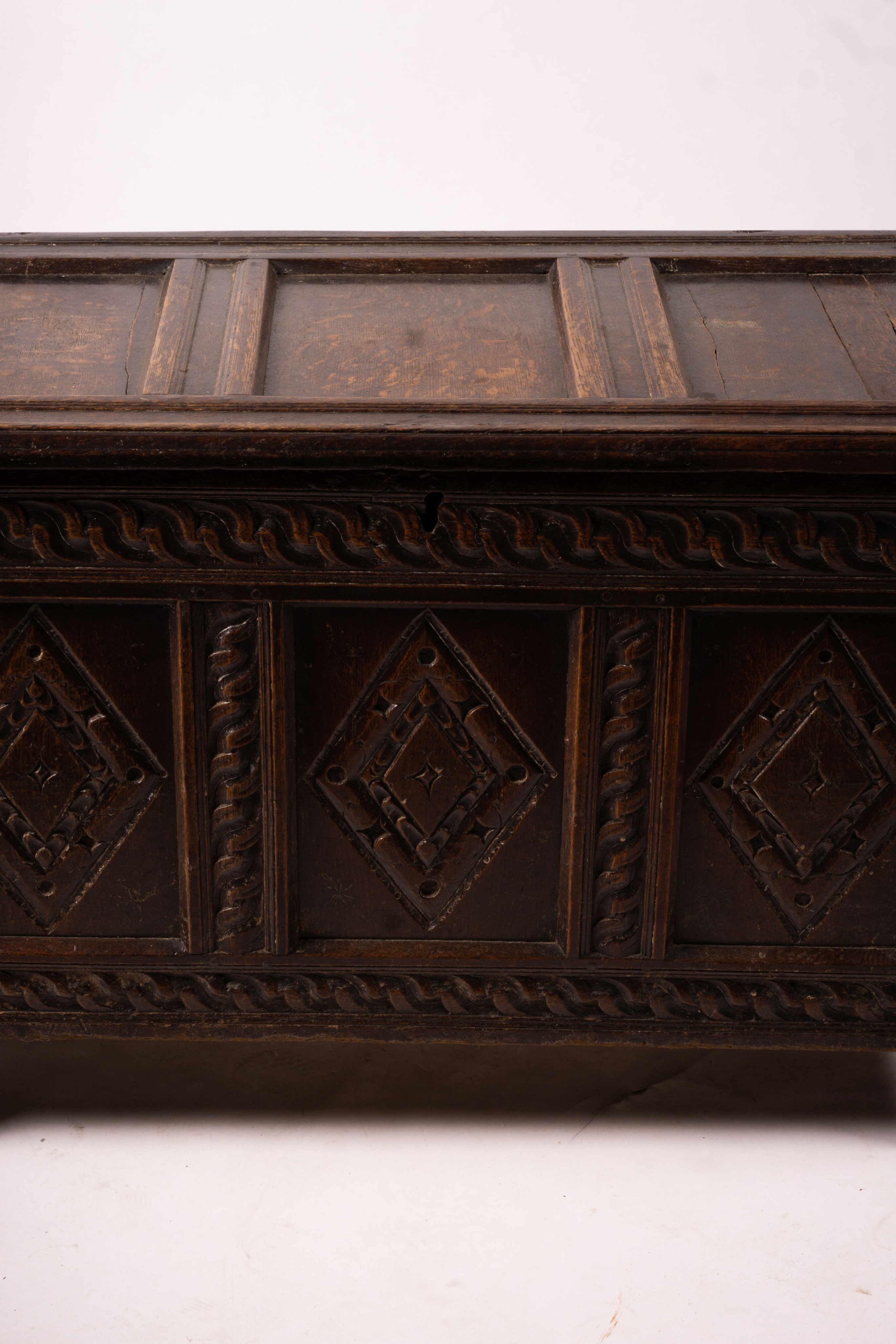 A 17th century carved panelled oak coffer, length 115cm, depth 56cm, height 67cm